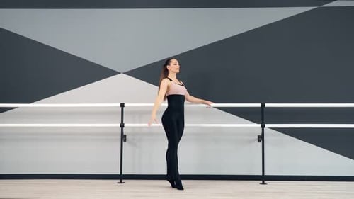 Female Dancer Training in Ballet Studio