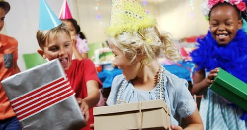 Excited Children Celebrating at Birthday Party with Gifts
