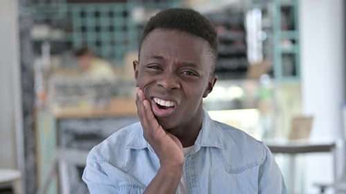 African Man having Toothache