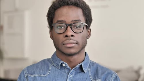 Adult Man Wearing Glasses Looking at Camera
