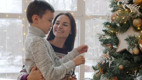 Happy Family Decorating Christmas Tree Together