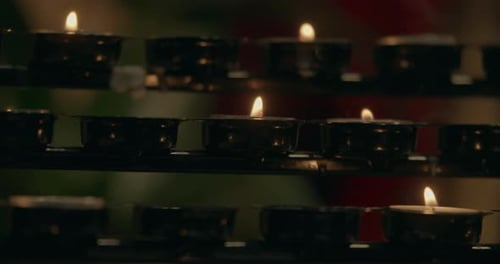 Cathedrals Praying Candles. Small Candle Light In A Gothic Church. Candle Of Hope.