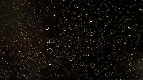 Water Droplets on Dark Surface Shimmering