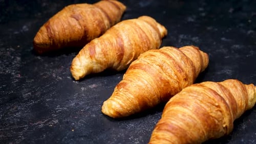 Croissants on a Vintage Black Background