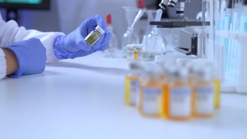 Close up of The Coronavirus vaccine researched by pharmaceutical bio research and development.