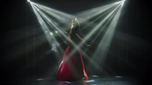 Elegant Woman Dancing in Spotlight with Red Dress