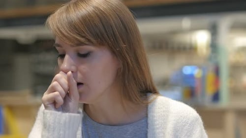 Woman Coughing with a Cold or Illness