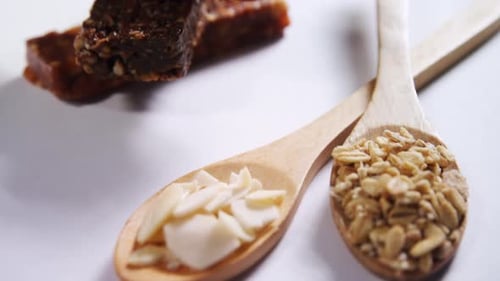 Granola bars with cereals in spoon ready for breakfast 4k