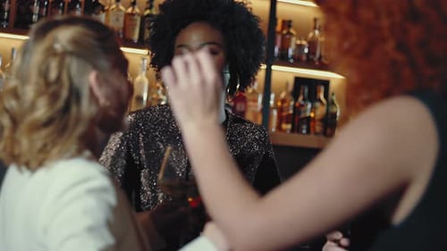 Friends dancing in a cocktail bar