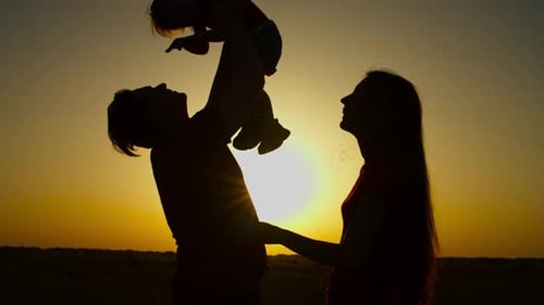 Family Silhouette at Golden Sunset