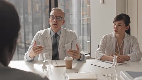 Medical Professionals Meeting in Modern Office Setting