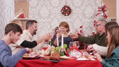 Family Gathering at Christmas Dinner Celebrates Togetherness