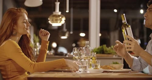 Couple Enjoying Romantic Candlelit Dinner at Home
