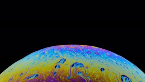 Iridescent Dome Shimmers Against Black Backdrop