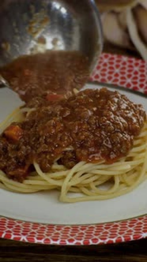 Spaghetti Topped with Meat Sauce and Parmesan