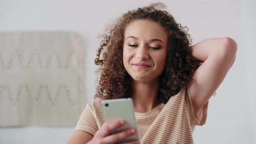 Close up of beautiful teenage girl using a smart phone