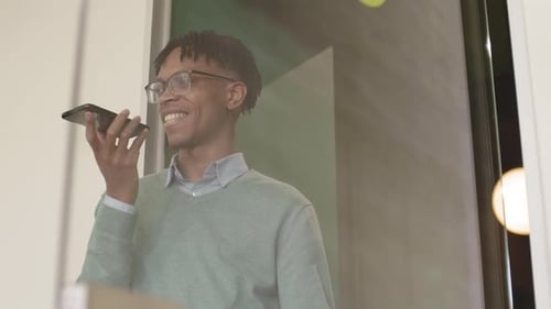 Young adult using voice commands on phone