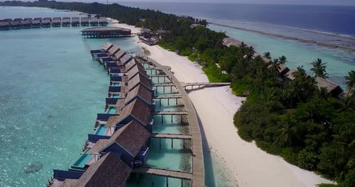 Tropical drone tourism shot of a summer white paradise sand beach and blue water background in high