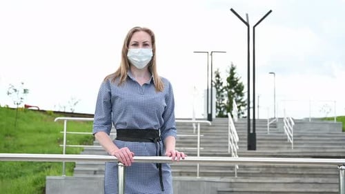 Masked Girl in a Public Place in the City. Protection Against Viruses and Epidemiccovid-19. Pandemic