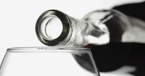 Red Wine Pouring into Glass Close Up