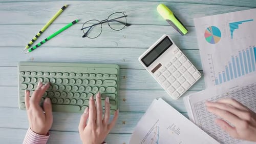 Typing on Keyboard at Business Desk