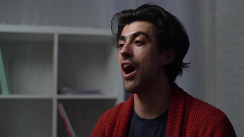 Man Talks in an Indoor Setting