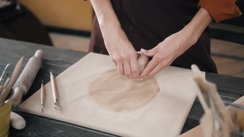 Woman Shaping Clay in Pottery Studio Close Up