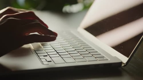 Close Up of Woman Hands Typing Code on a Laptop in 90 Fps Slow Motion on a Sunset Sun