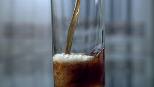 Soda Is Poured Into a Glass, Close-up, Upward Movement