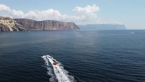 Jet Ski Pulls Raft on Ocean Adventure