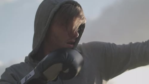 Man Boxing In The Park In The Evening Sun In Slow Motion - Ungraded