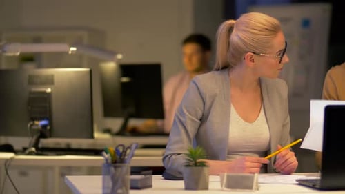 Business Team Papers Working at Night Office