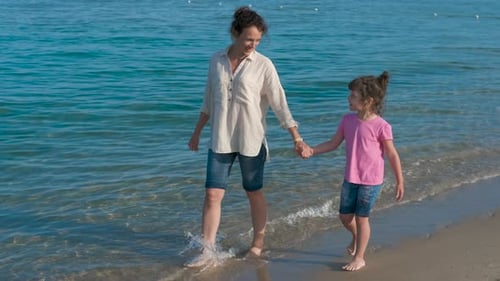 Sunny family sea walk