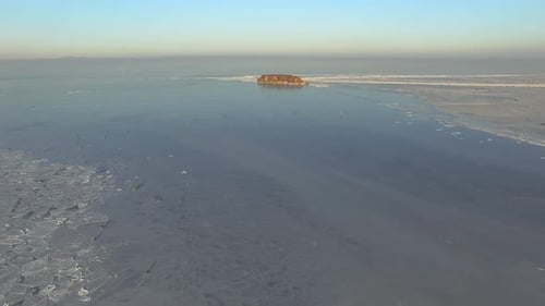 Drone View Rocky Island Among Icecovered Winter Sea