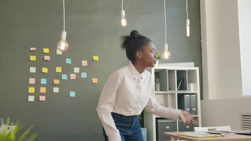 Slow Motion of Funny Mixed Race Girl Dancing in Office Room Having Fun Alone