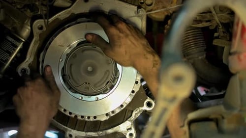 Hands of a Mechanic Adjustic Metal Car Clutch