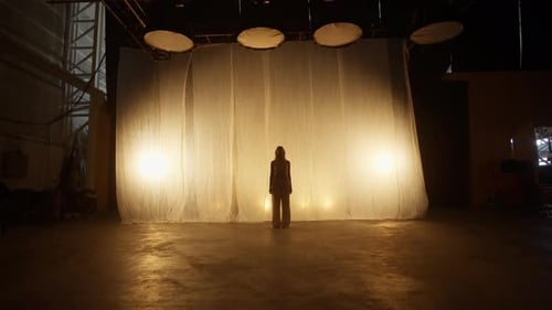 Professional Dancer Performing in Studio in Soft Warm Lighting