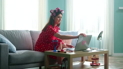 Woman on Laptop Video Call in Bright Home