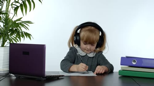 Online Learning, Distance Education, Lesson at Home. Girl Doing School Program Online on Computer