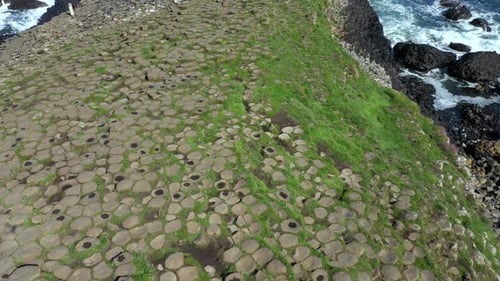 The Giants Causeway lies at the foot of the basalt cliffs along the sea coast on the north shores of