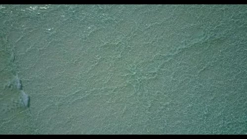 Aerial flying over scenery of marine sea view beach journey by blue green ocean with white sandy bac