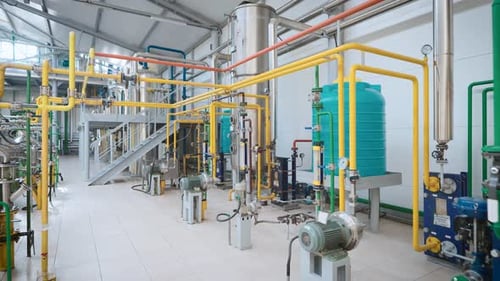 Large Light Workshop with Metal Containers and a Complex Piping System
