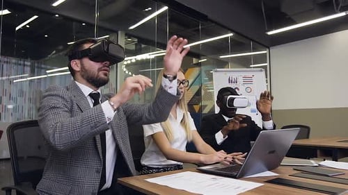 Colleagues Explore Virtual Reality in Modern Office