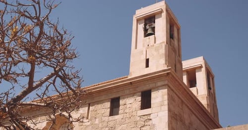 Camera Zooming Out Showing Church Bell on a Tower