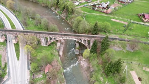 Old viaduct bridge in Vorokhta, Carpathians, Ukraine. Historic railway bridge