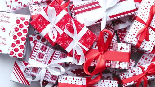 Christmas Concept. Close Up on Festive Paper Wrapped Gifts with Ribbon