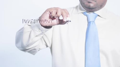 Writing Investment Property On Clear Surface