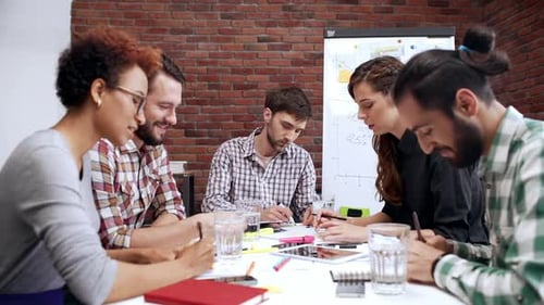 Group of Young Adults Meeting in Modern Office