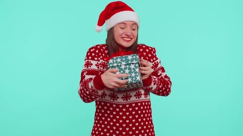 Woman Excited to Receive Christmas Gift