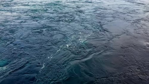 Waves of Water of the River and the Sea Meet Each Other During High Tide and Low Tide